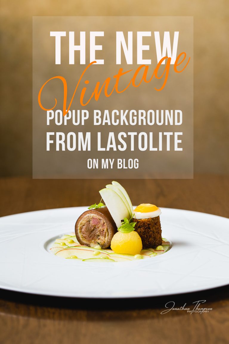 Promotional image with a fine dining pigs trotter dish and text saying, The New Vintage Popup Background from Lastolite